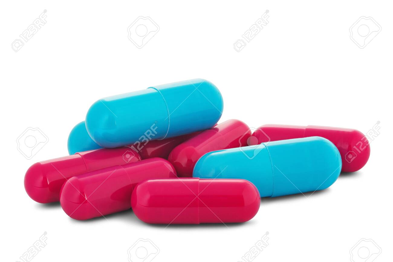 Pile of medical pills in red and blue colors on white isolated background with shadow. - 128004728 Pile of medical pills in red and blue colors on white isolated background with shadow. - 128004728