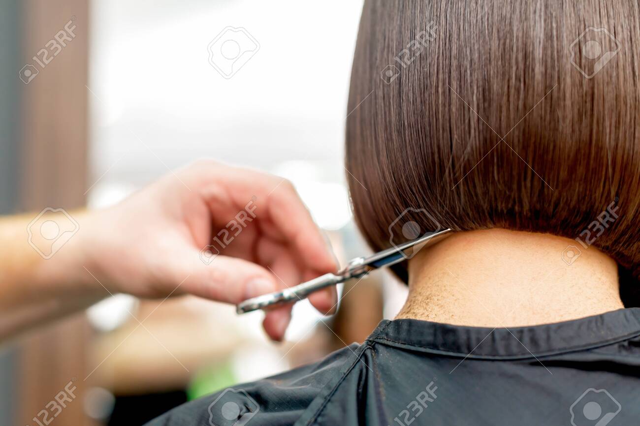Back View Of Hairdresser Hand Is Cutting Hair Tips Of Woman Short Hairstyle In Hair Salon. Stock Photo, Picture And Royalty Free Image. Image 145810619. Back View Of Hairdresser Hand Is Cutting Hair Tips Of Woman Short Hairstyle In Hair Salon. Stock Photo, Picture And Royalty Free Image. Image 145810619.