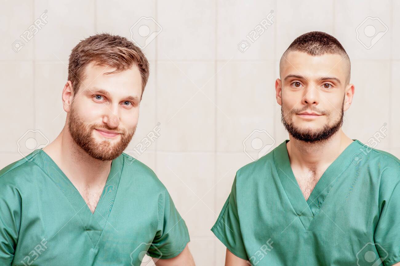 Portrait Of Two Male Massage Therapists