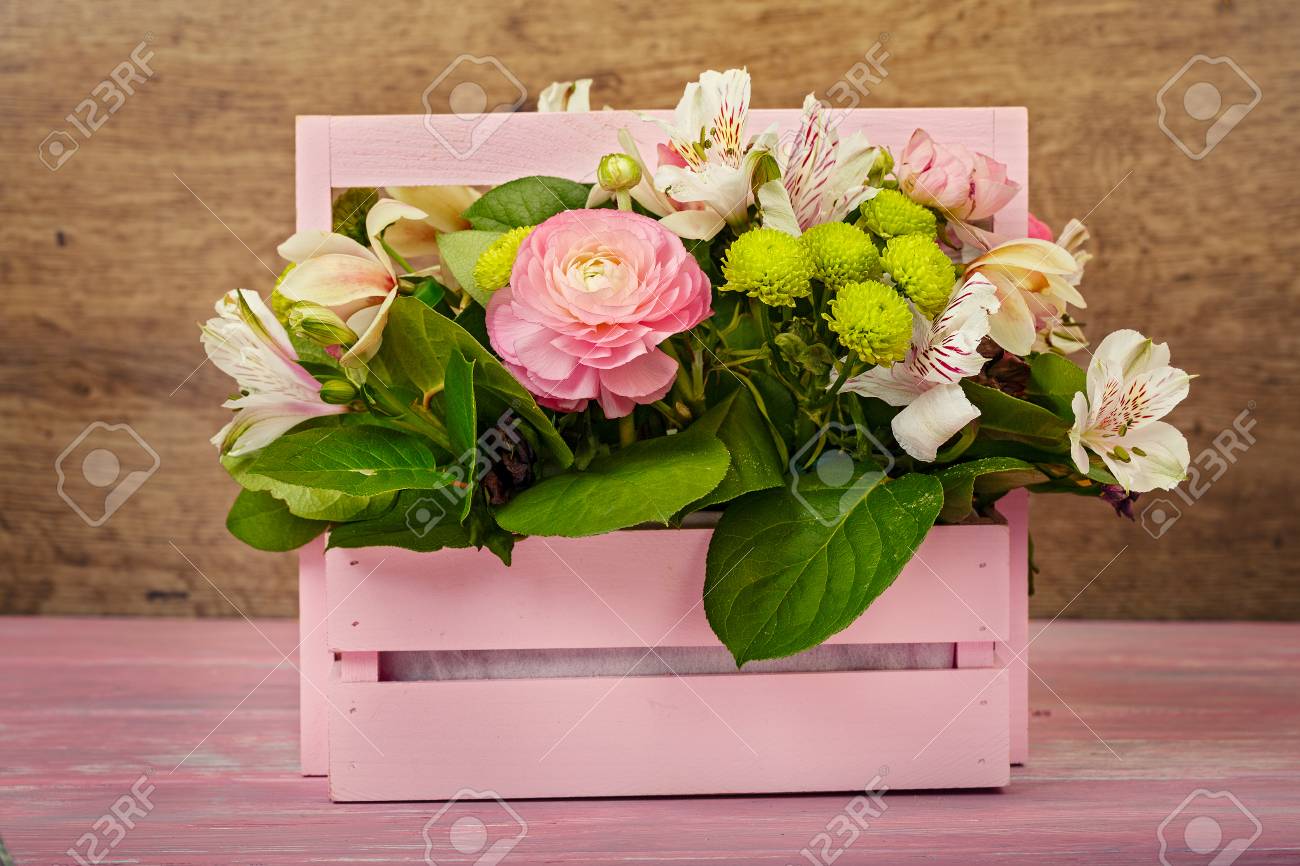 Arrangement With Flowers In A Pink Wooden Box Stock Photo Picture And Royalty Free Image Image 97482512