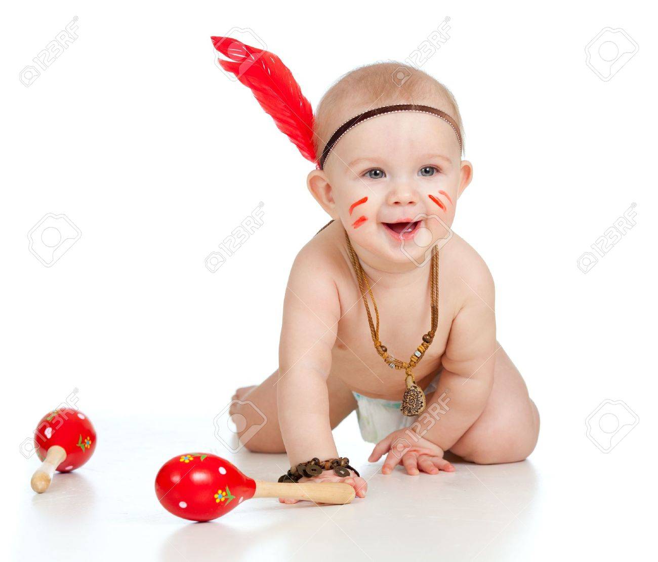 Smiling Indian Boy Baby With Maracas And Feather Stock Photo Picture And Royalty Free Image Image