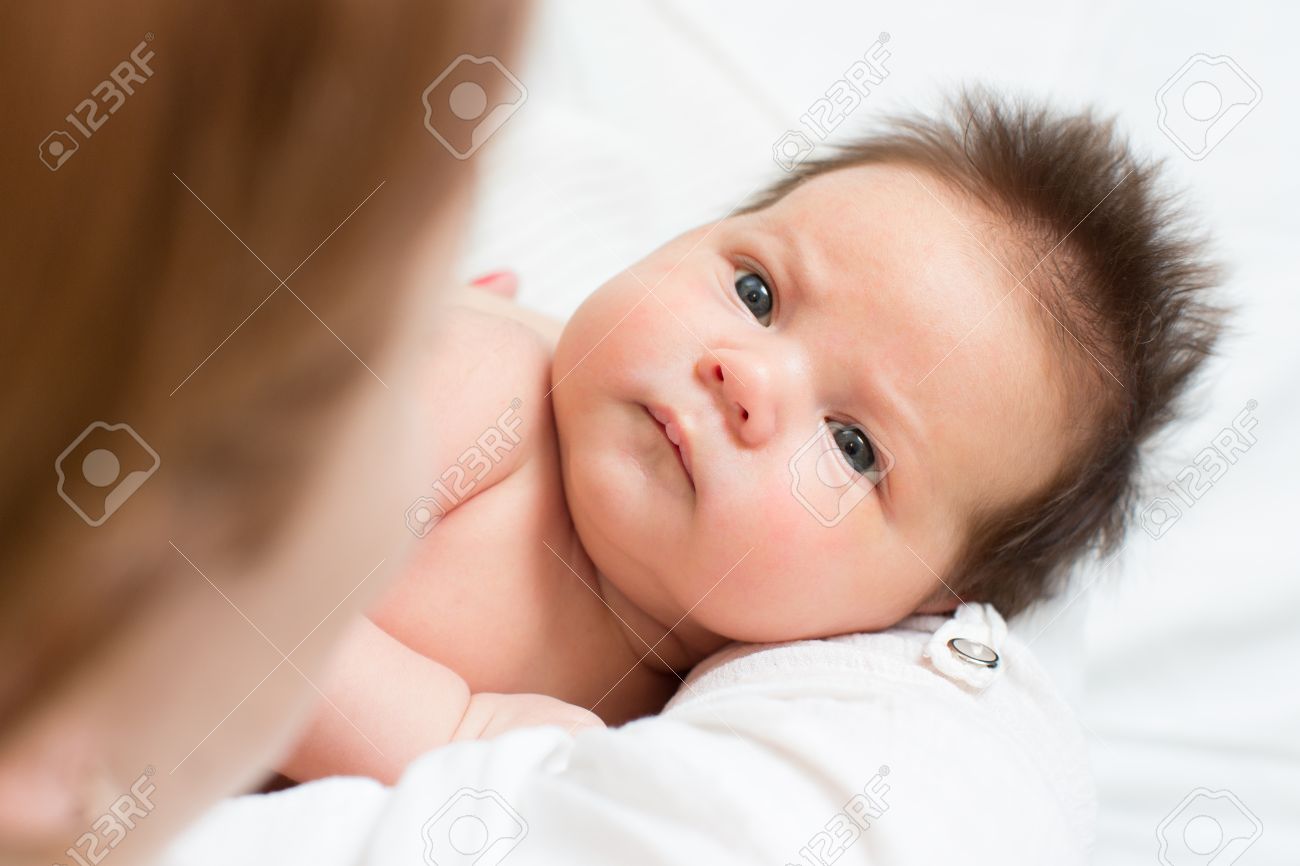 baby looking at mom