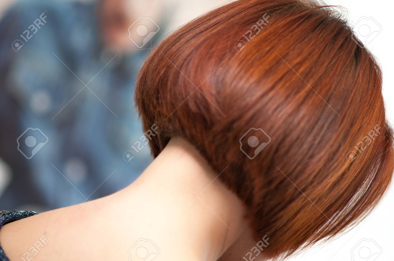 Accurate Geometric Shape Short Haircut On A Woman With Red Hair