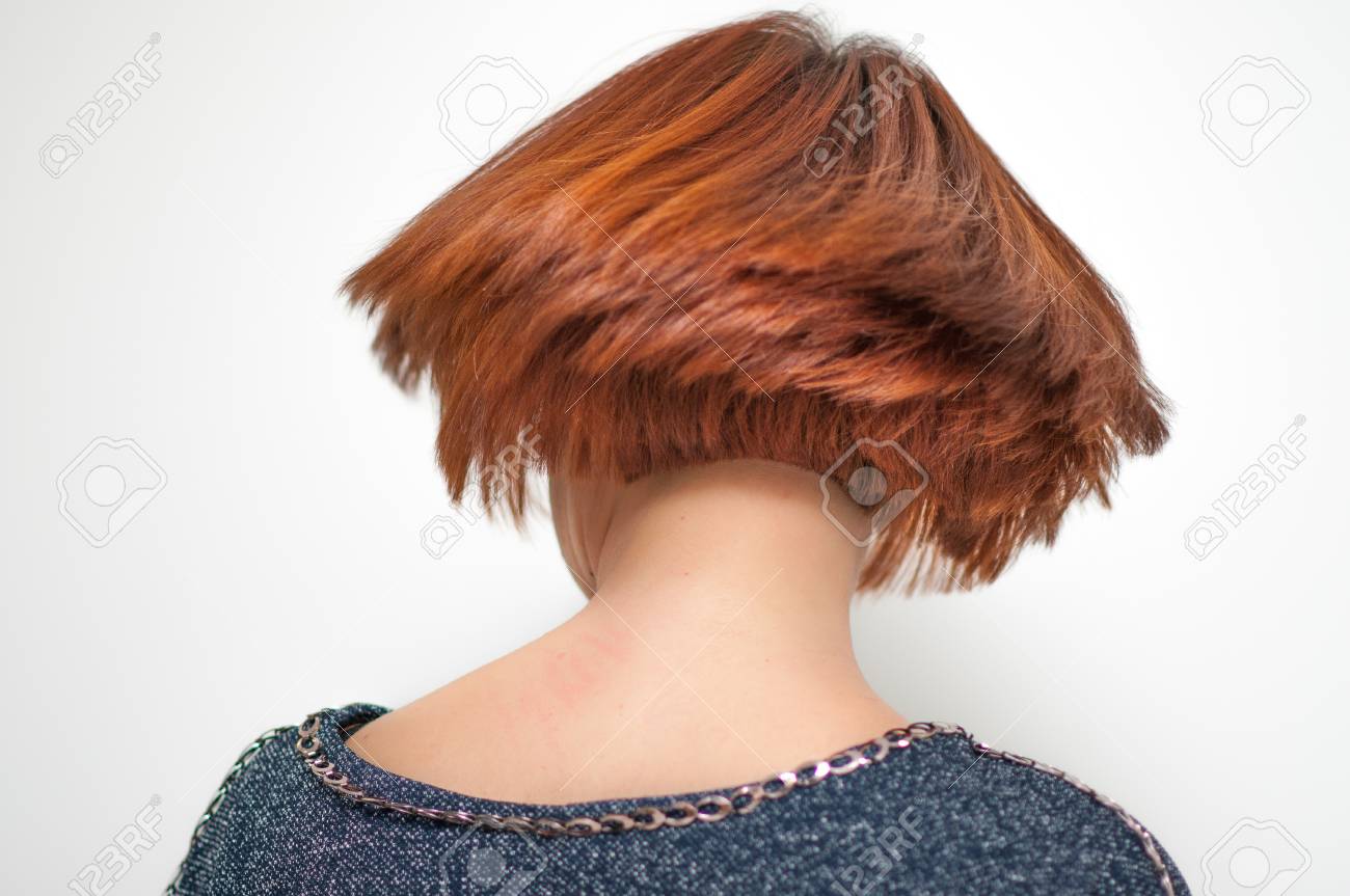 Accurate Geometric Shape Short Haircut On A Woman With Red Hair