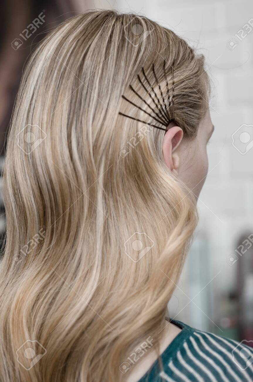Blonde Girl With Long Hair In A Beauty Salon With Wave Hairstyle