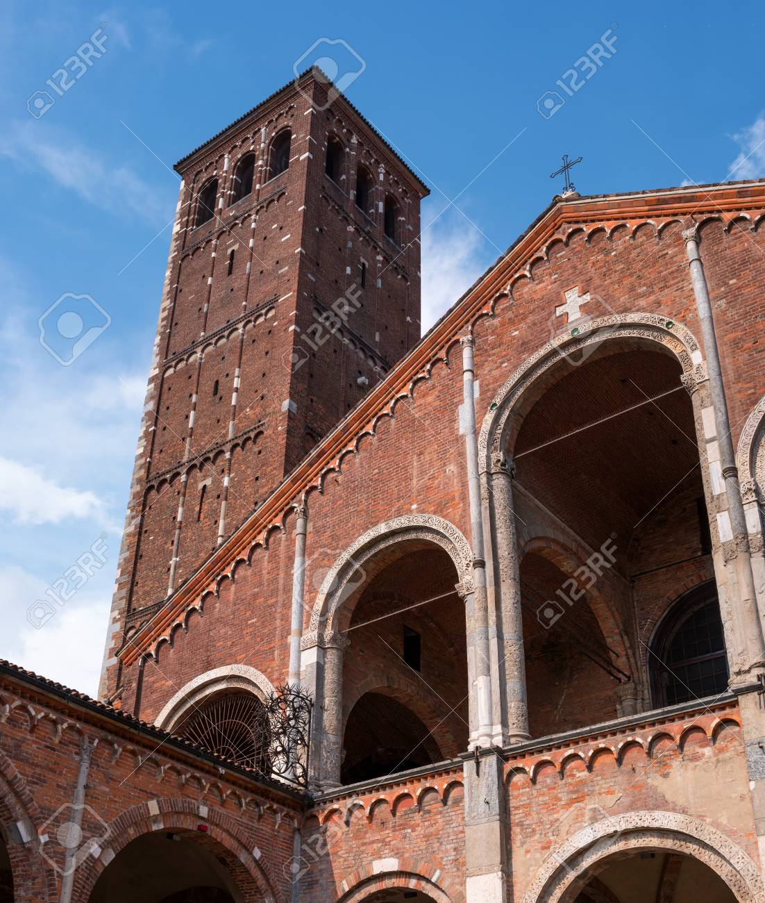 Milan, Lombardy, Italy. Bell Tower Of The Church Of SantAmbrogio. In The  Church Of Sant Ambrogio There Are Relics Of St. Ambrose Of Milan And The  Martyrs Gervasius And Protasius Stock Photo,, image size:1102x1300