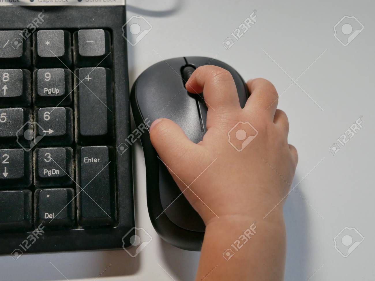 Little Asian Baby S Hand 16 Months Old On A Computer Mouse Stock Photo Picture And Royalty Free Image Image