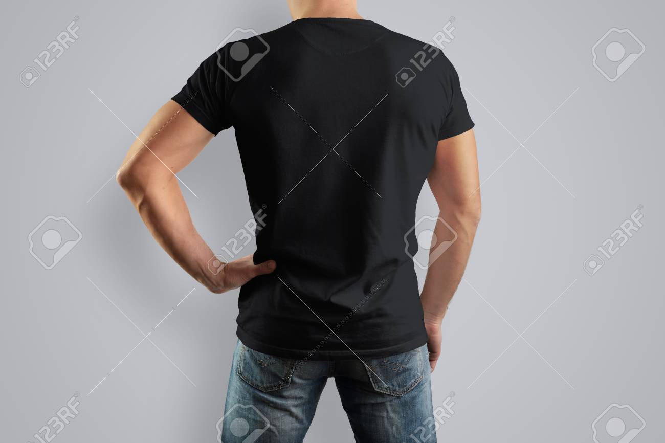 mockup black t shirt on a back strong man in blue jeans isolated