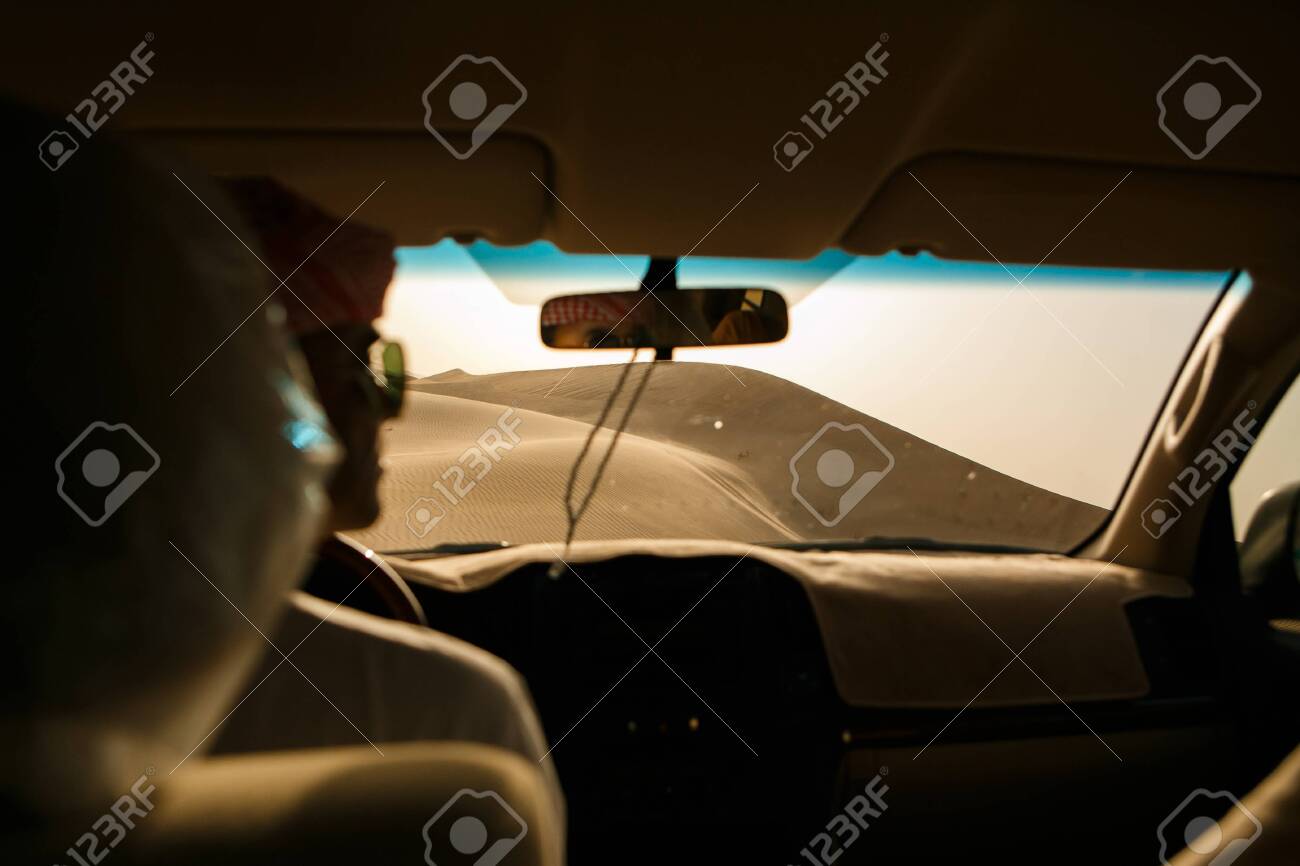 Adventure, travel or active and extreme vacation concept: extreme safari. View of the sand dune from the off-road car. - 126264923 Adventure, travel or active and extreme vacation concept: extreme safari. View of the sand dune from the off-road car. - 126264923