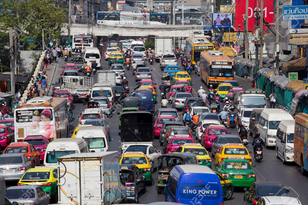 BANGKOK, THAILAND - JANUARY 22, 2015: Traffic moves slowly along a busy road in Bangkok, Thailand. Annually an estimated 150,000 new cars join the already heavily congested streets of Bangkok. - 49299663 BANGKOK, THAILAND - JANUARY 22, 2015: Traffic moves slowly along a busy road in Bangkok, Thailand. Annually an estimated 150,000 new cars join the already heavily congested streets of Bangkok. - 49299663