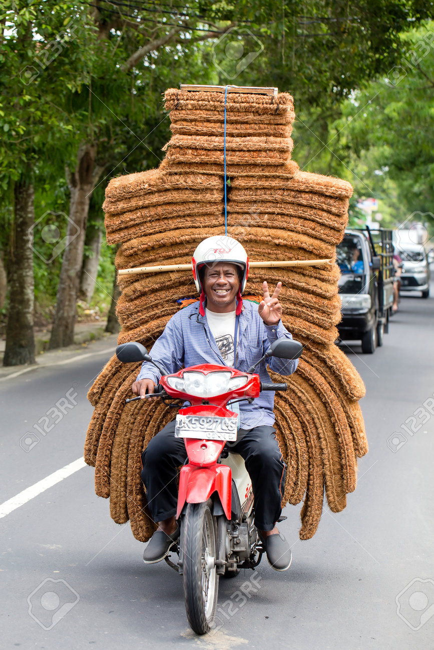 Ubud Bali Indonesia January 13 2018 Unidentified Man Is Transporting Goods On A Motorbike On A Street In Ubud Island Bali Indonesia Close Up Stock Photo Picture And Royalty Free Image Image 93669149