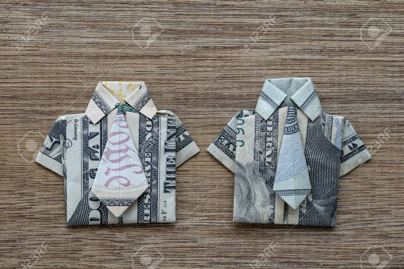 Origami Shirt Made Of Dollar Banknote On Wooden Background Close