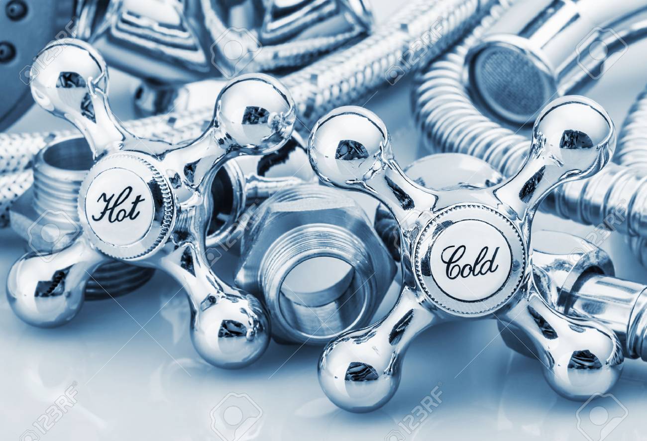 plumbing and tools in a light background. Focus on plumbing taps. toning - 37663071 plumbing and tools in a light background. Focus on plumbing taps. toning - 37663071