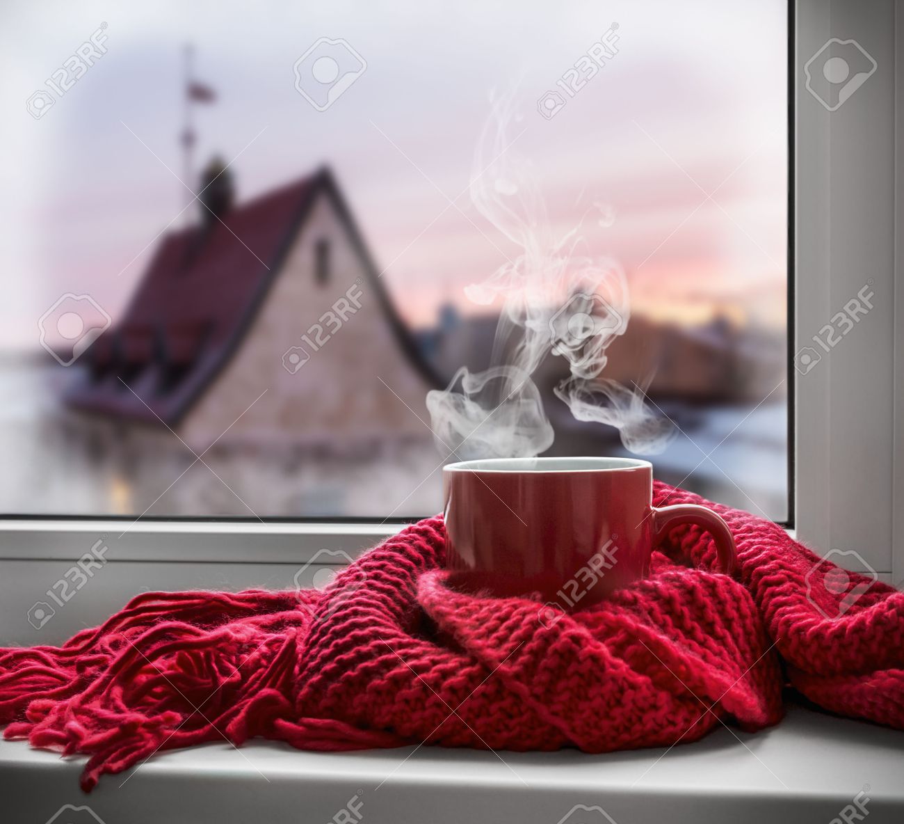 cup with a hot drink on the windowsill in the background of a winter city. Focus on the edge of the cup - 44713977 cup with a hot drink on the windowsill in the background of a winter city. Focus on the edge of the cup - 44713977
