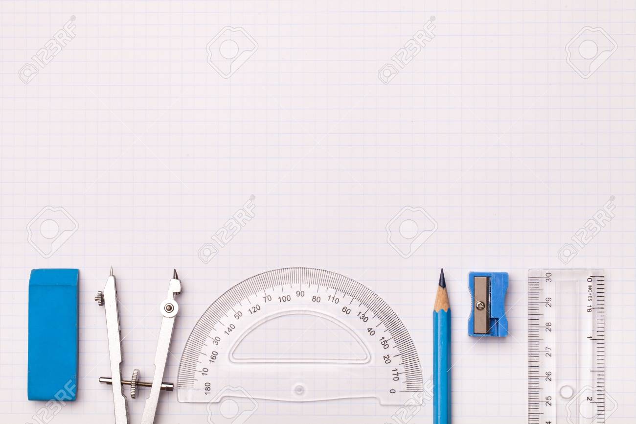 mathematical instruments surrounding a graph paper creating copy