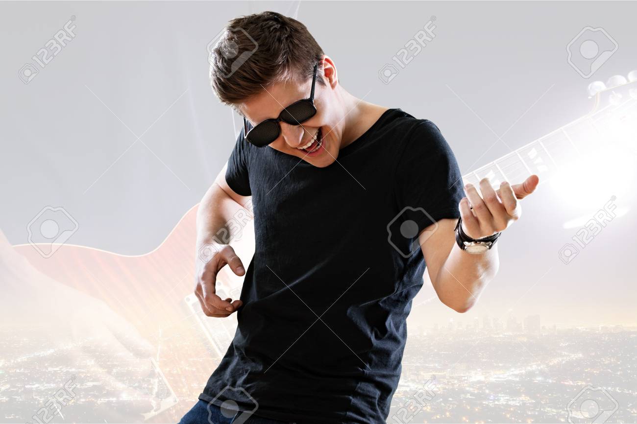 91446140-young-man-playing-invisible-guitar.jpg