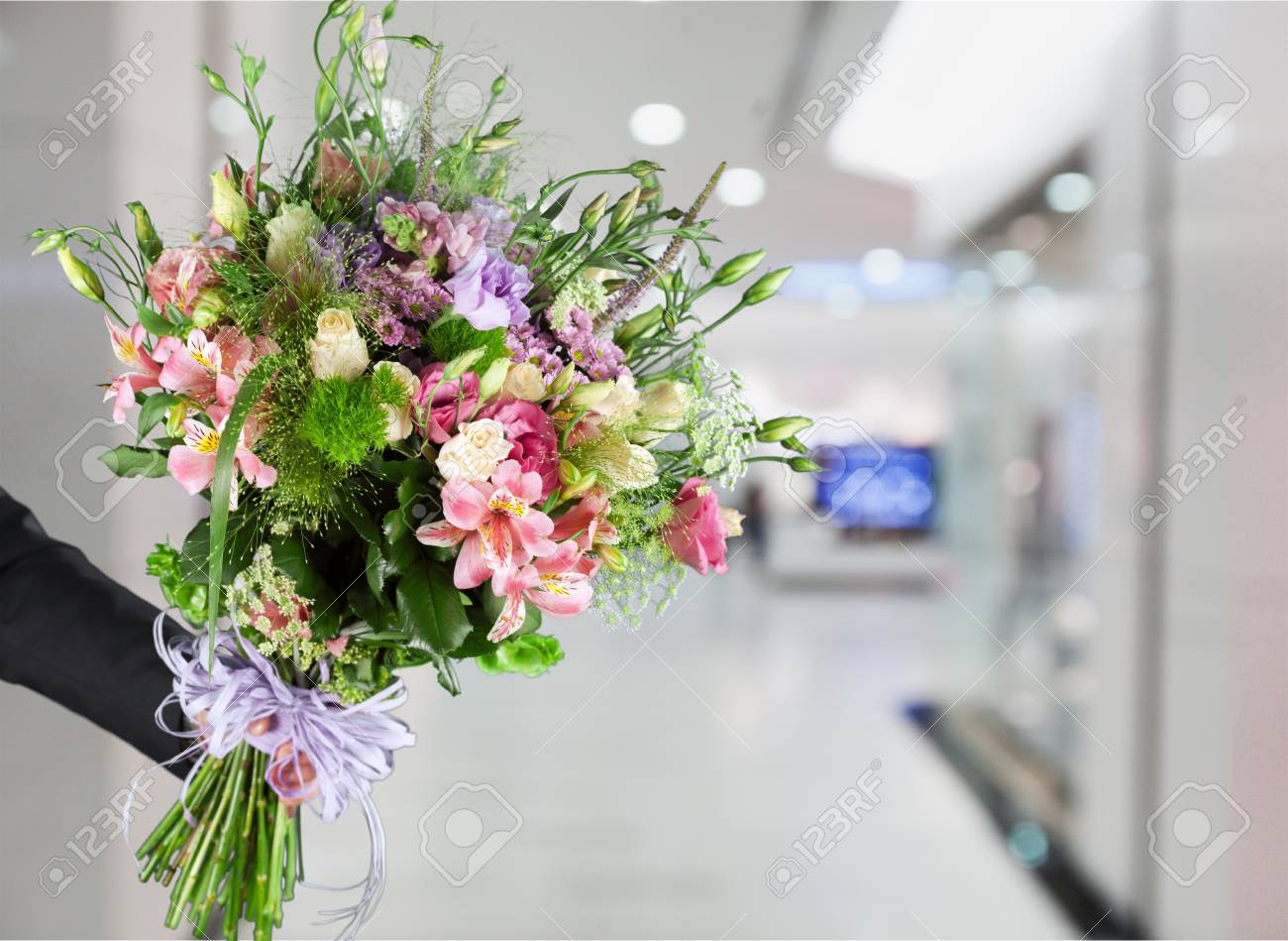hand giving a flower bouquet stock photo picture and royalty free