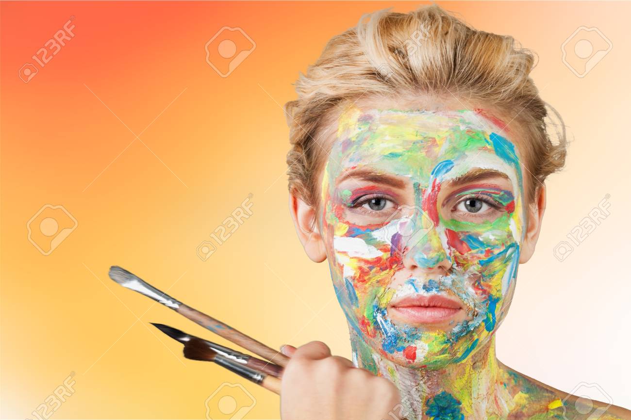 Woman artist with paint face - 108236637 Woman artist with paint face - 108236637