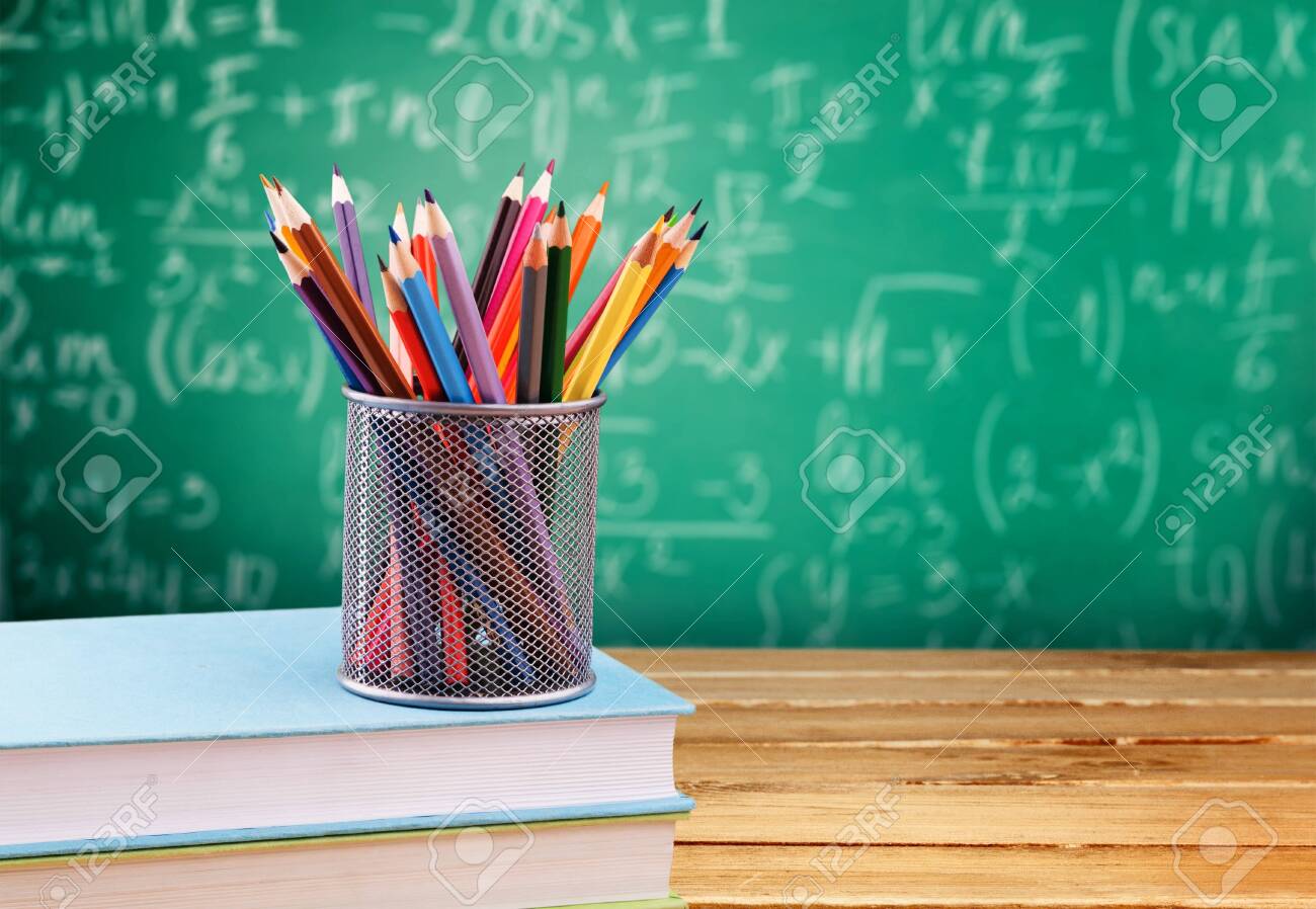 Maths formulas written by chalk on the blackboard background. - 124467001 Maths formulas written by chalk on the blackboard background. - 124467001