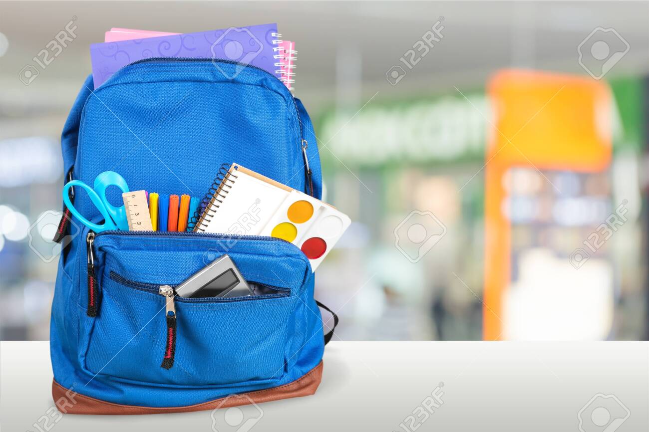 School Backpack with stationery on wooden table - 124465414 School Backpack with stationery on wooden table - 124465414