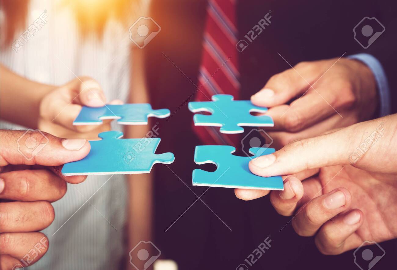 Business people holding puzzle pieces. problem solution concept - 124316455 Business people holding puzzle pieces. problem solution concept - 124316455