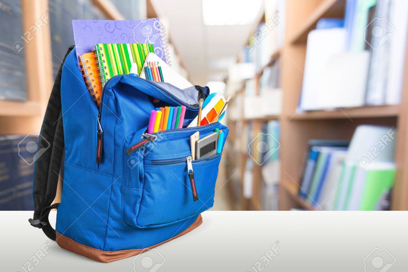 School Backpack with stationery on wooden table - 127184340 School Backpack with stationery on wooden table - 127184340