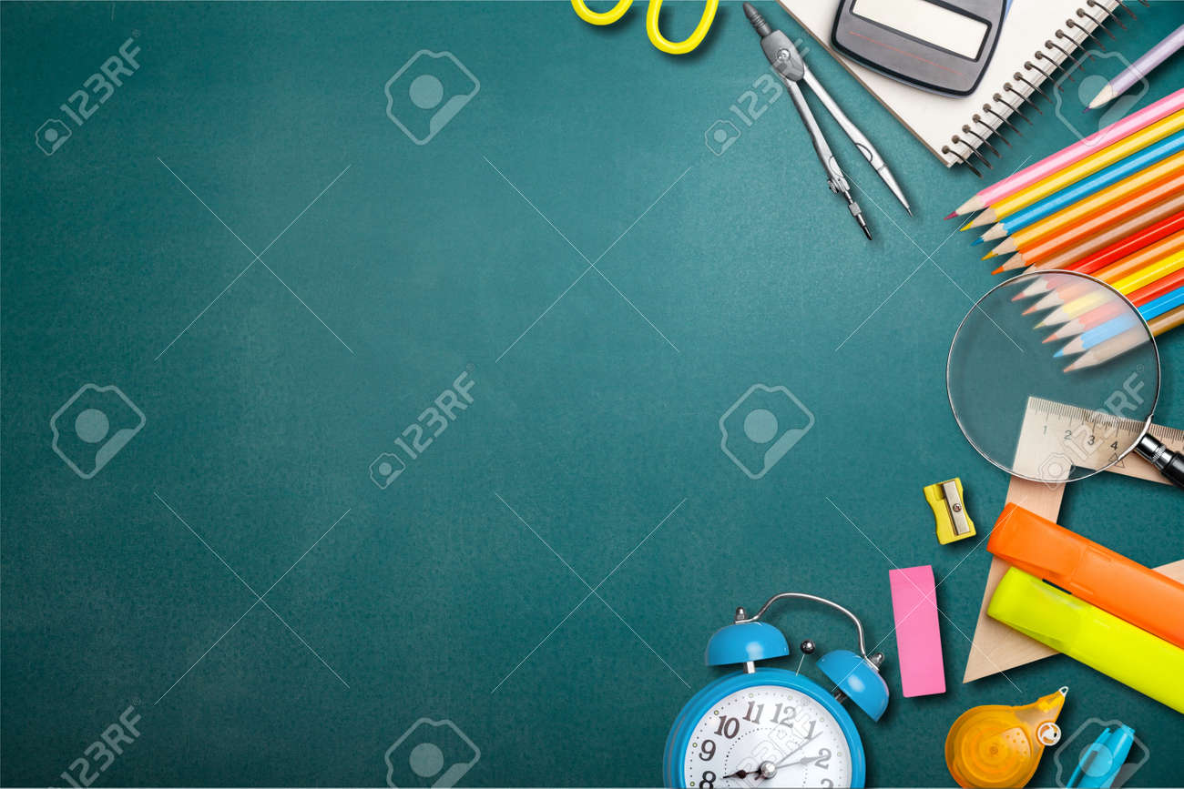 School supplies on black board background. Back to school concept - 128901293 School supplies on black board background. Back to school concept - 128901293