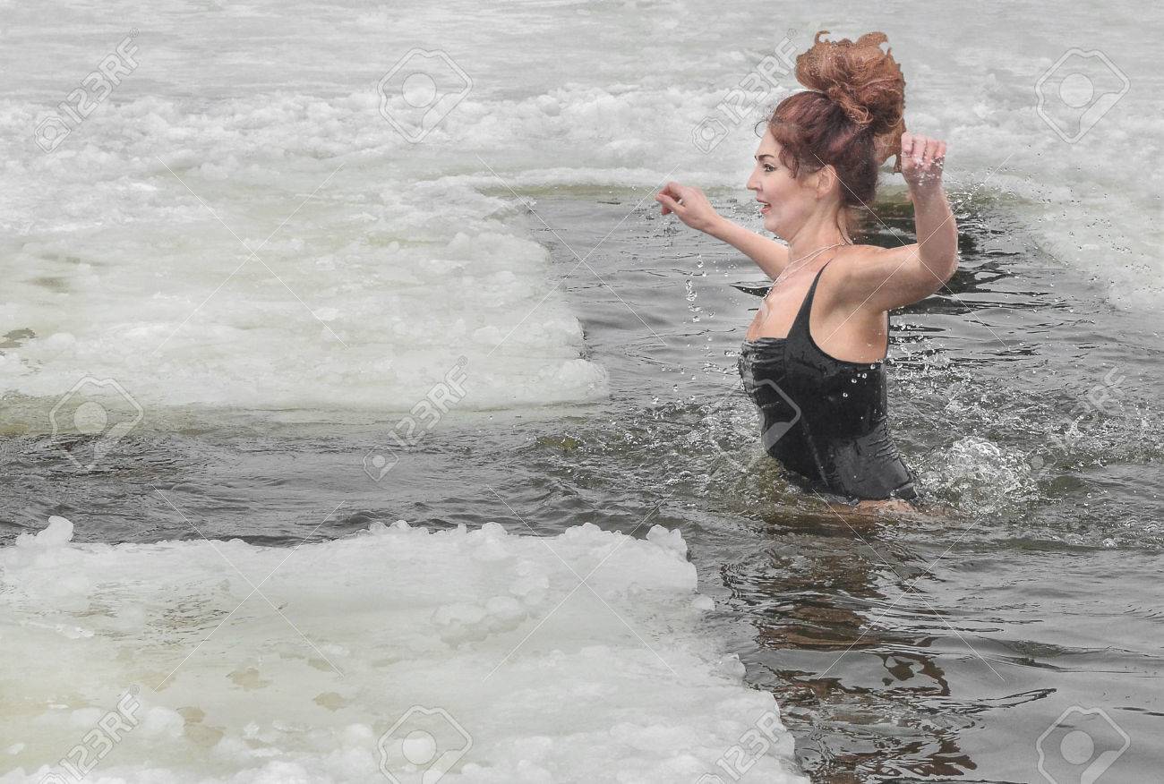 Women bathed in the river in the winter. The Christian holiday of Epiphany - 51587763 Women bathed in the river in the winter. The Christian holiday of Epiphany - 51587763