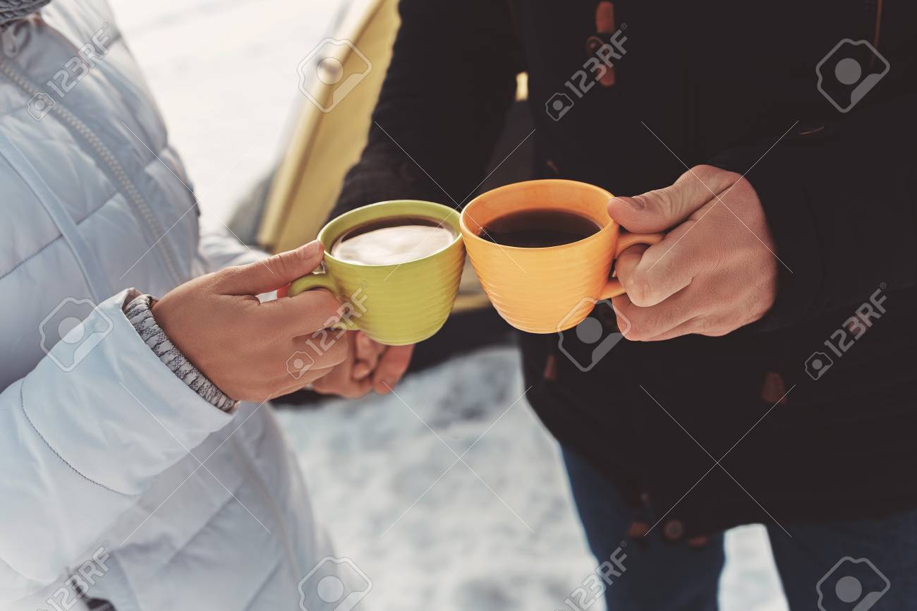73636666-two-cups-of-tea-in-the-hands-of-loving-couple.jpg