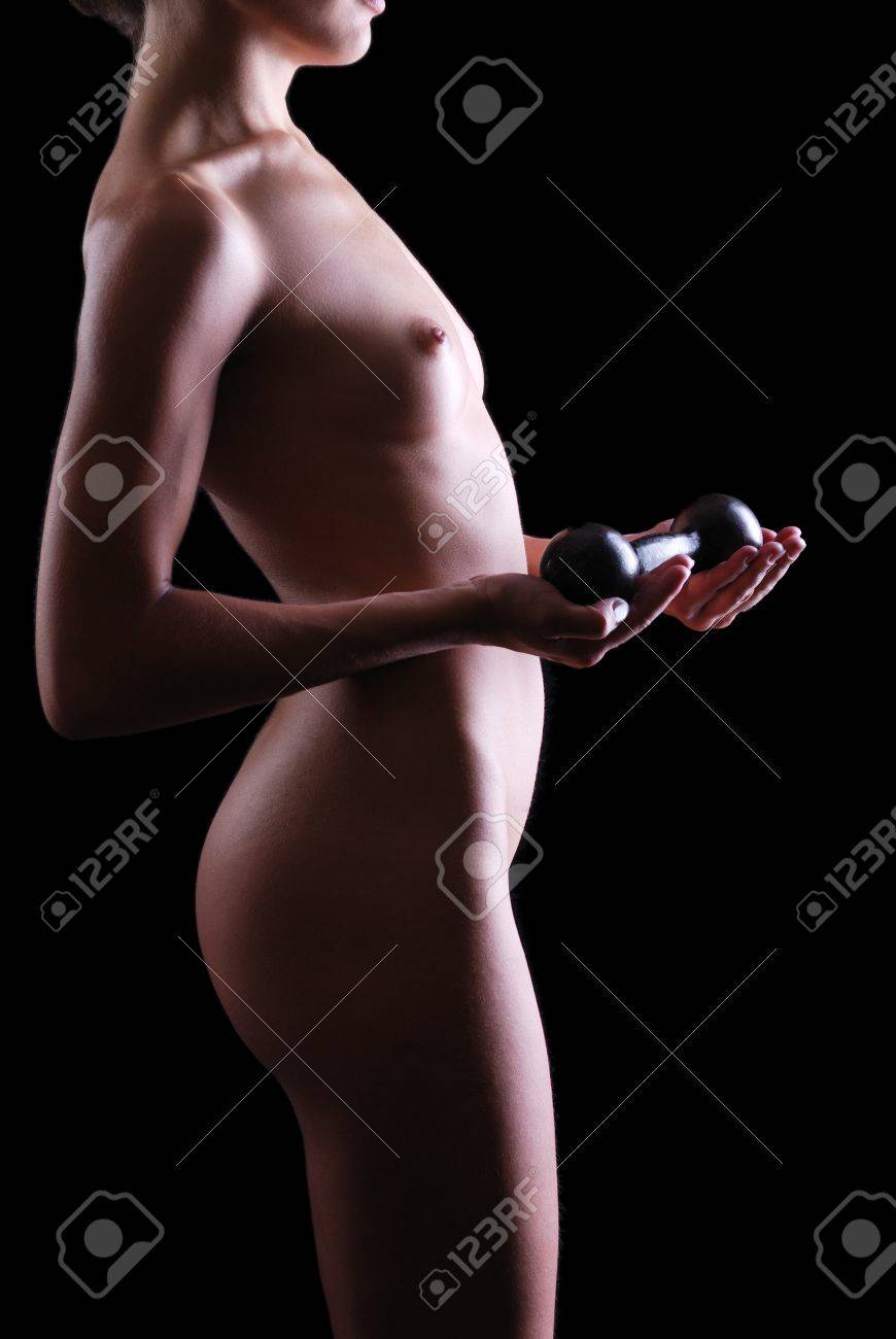 Naked Woman Is Holding Dumbbell. Her Neat Body Is Photographed In The Dark  With A Few Highlights. Stock Photo, Picture and Royalty Free Image. Image  12821949.