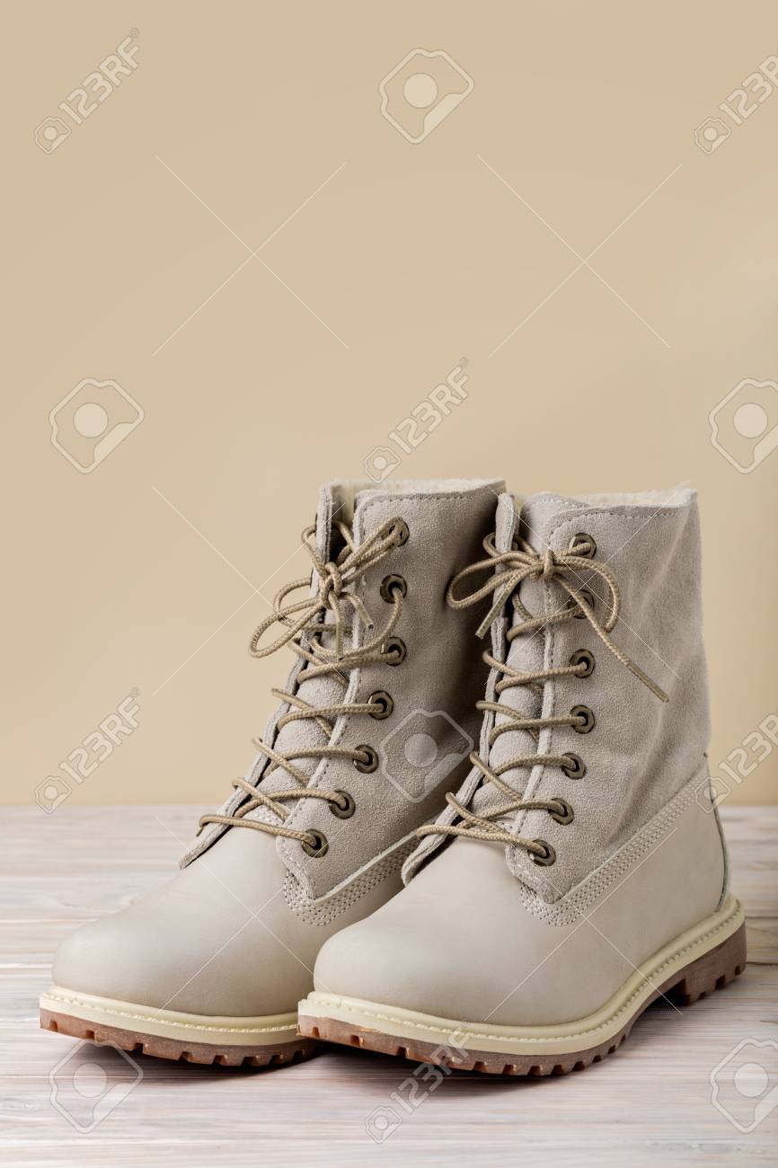 light winter boots on Bright Leather Winter Boots On A Light Wooden Background Stock Photo Picture And Royalty Free Image Image 69326476