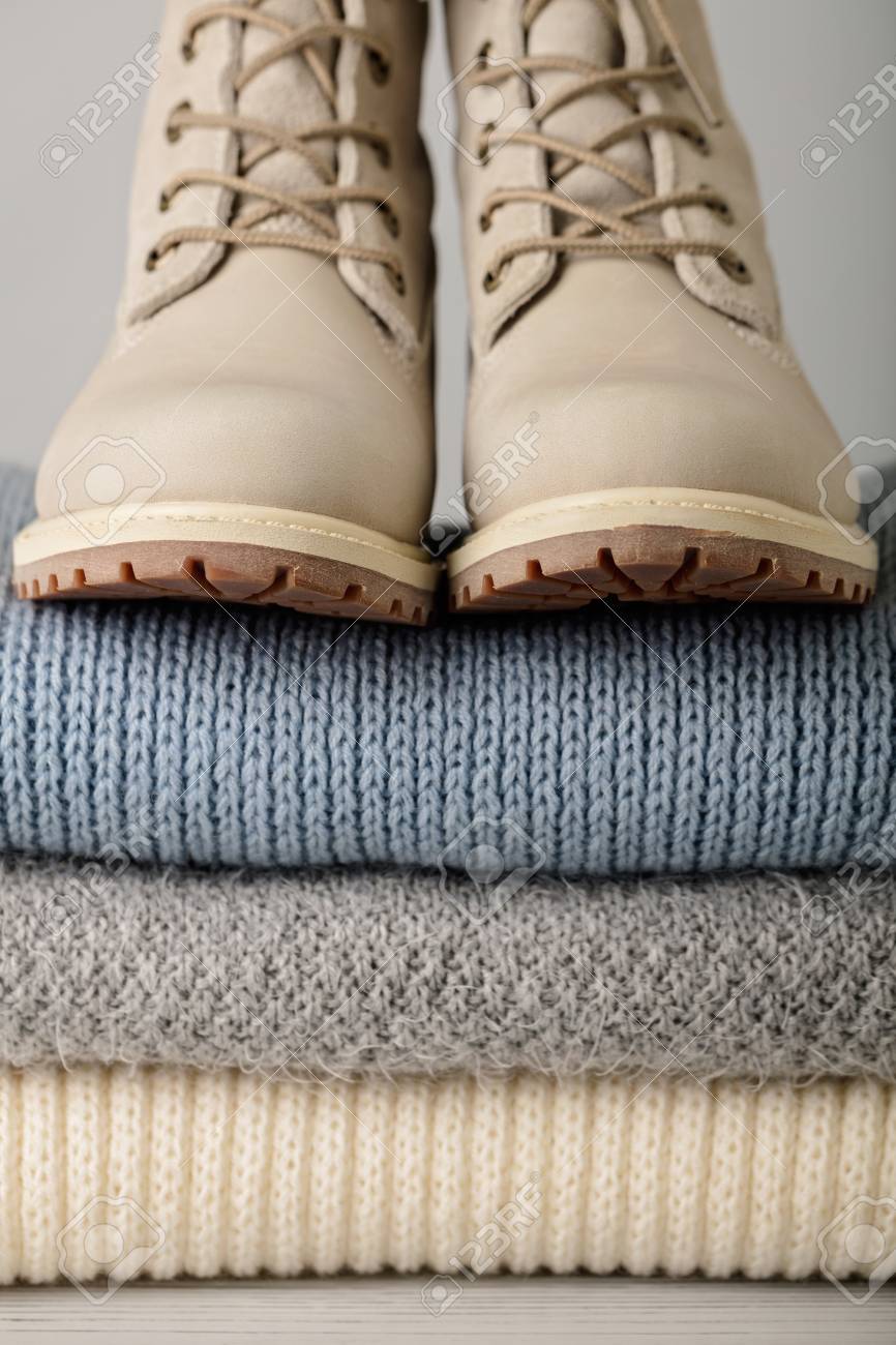 light winter boots on Leather Women S Light Winter Boots And A Pile Of Knitted Things Stock Photo Picture And Royalty Free Image Image 91306847