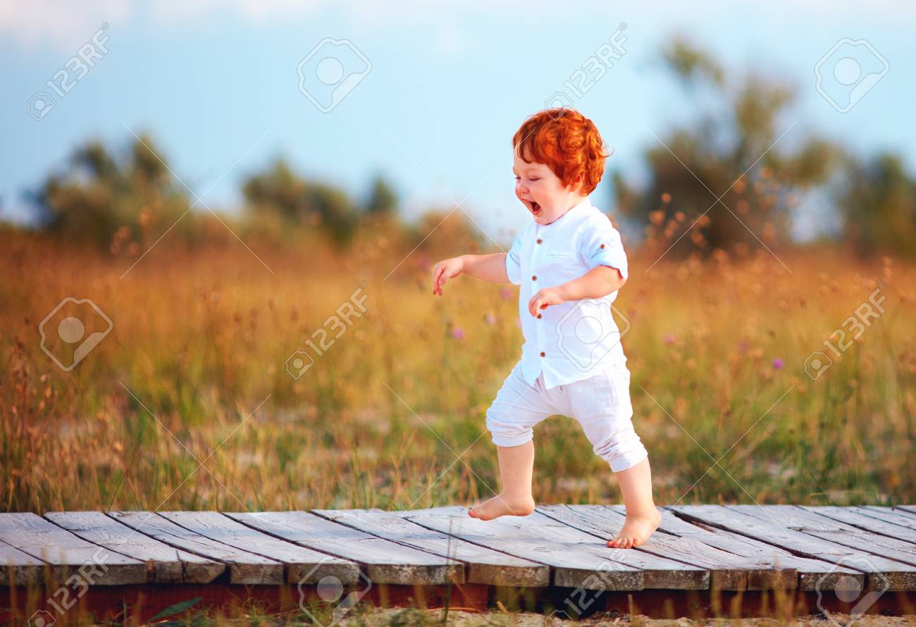 Happy Toddler Baby Running The Path On Summer Field Stock Photo Picture And Royalty Free Image Image
