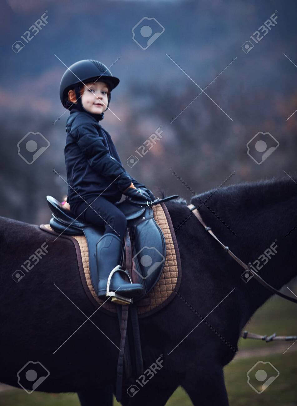 Young Boy, Kid Rider Stays Confidently