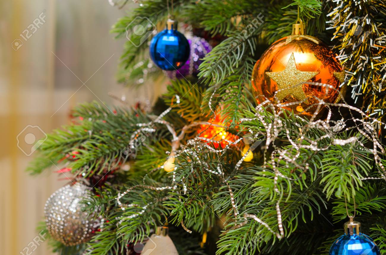 Multi Colored Christmas Balls On Green Branches Of Artificial Holiday Christmas Tree Stock Photo Multi Colored Christmas Balls On Green Branches Of Artificial Holiday Christmas Tree Stock Photo