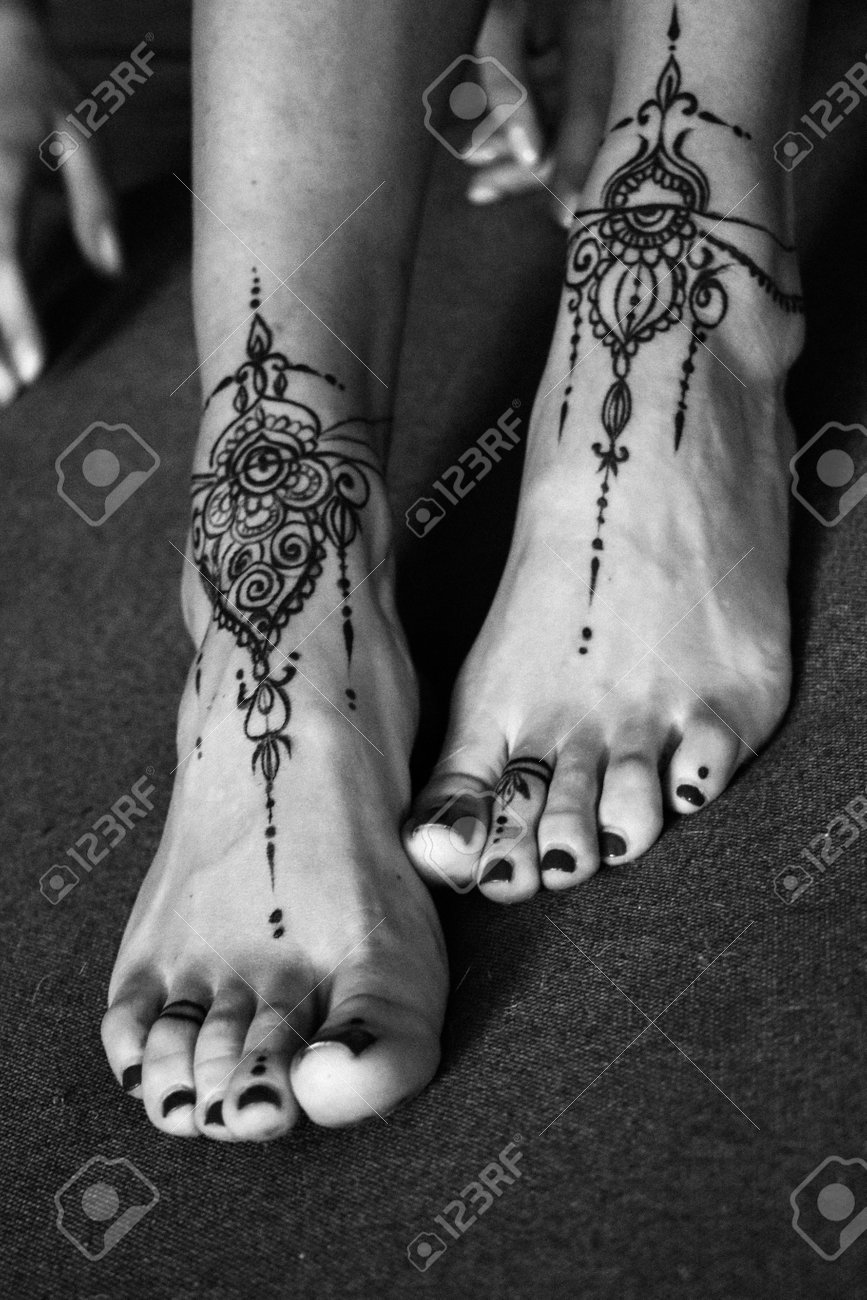 Close-up Of Female Legs And Hands With Henna Tattoo On The Feet. Black And  White Photo. Gently Feminine Graceful Decoration, Respect For A Woman, Love  And Take Care Of Yourself. Stock Photo,, image size:867x1300