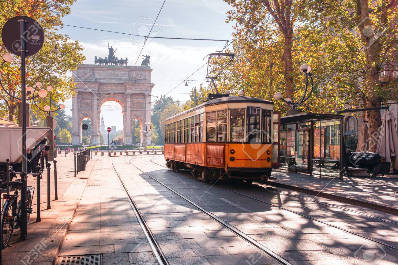 Famous vintage tram in the centre of the Old Town of Milan in the sunny day, Lombardia, Italy. Arch of Peace, or Arco della Pace on the background. - 95010246 Famous vintage tram in the centre of the Old Town of Milan in the sunny day, Lombardia, Italy. Arch of Peace, or Arco della Pace on the background. - 95010246