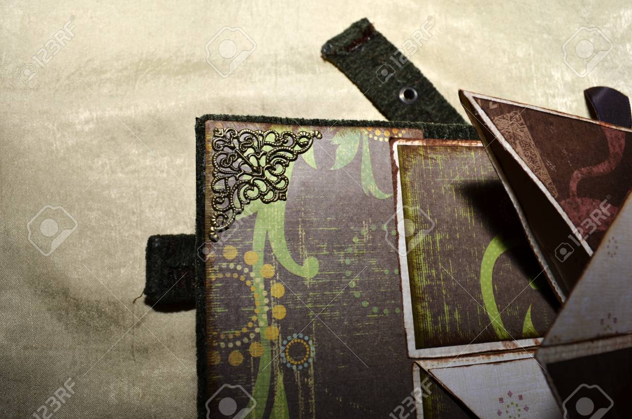 closeup of a decorative element inside handmade vintage looking vintage looking photo albums