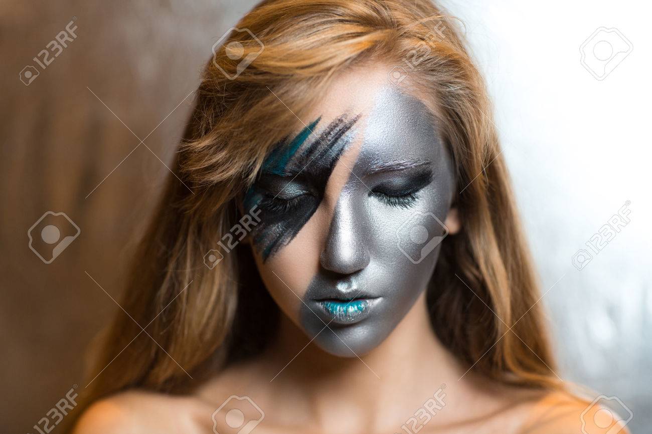 Woman With Silver Art Make Up Part Of Face Blue Lips Portrait