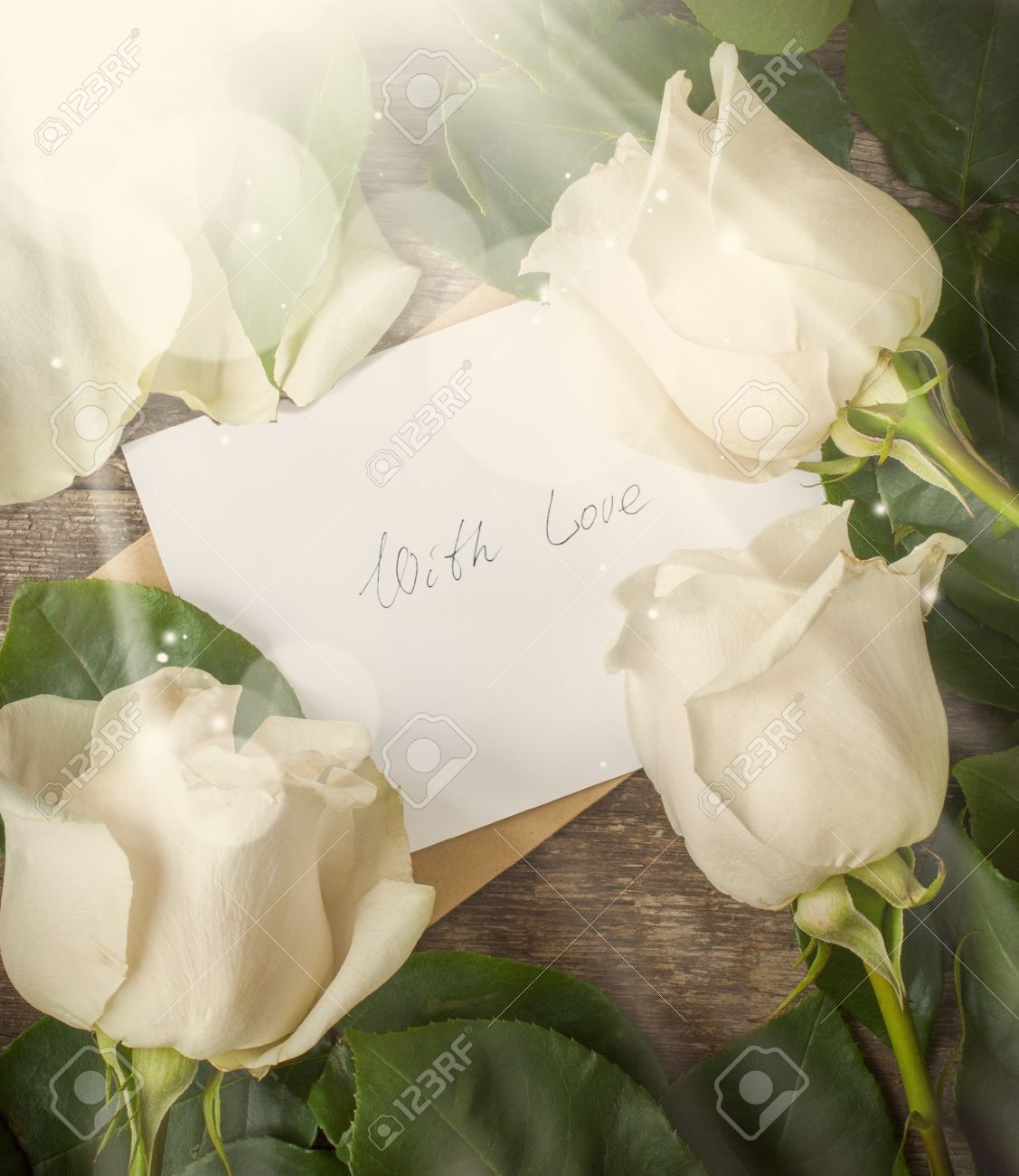 Card With Love Letter Love You And White Roses On The Wooden Table ...