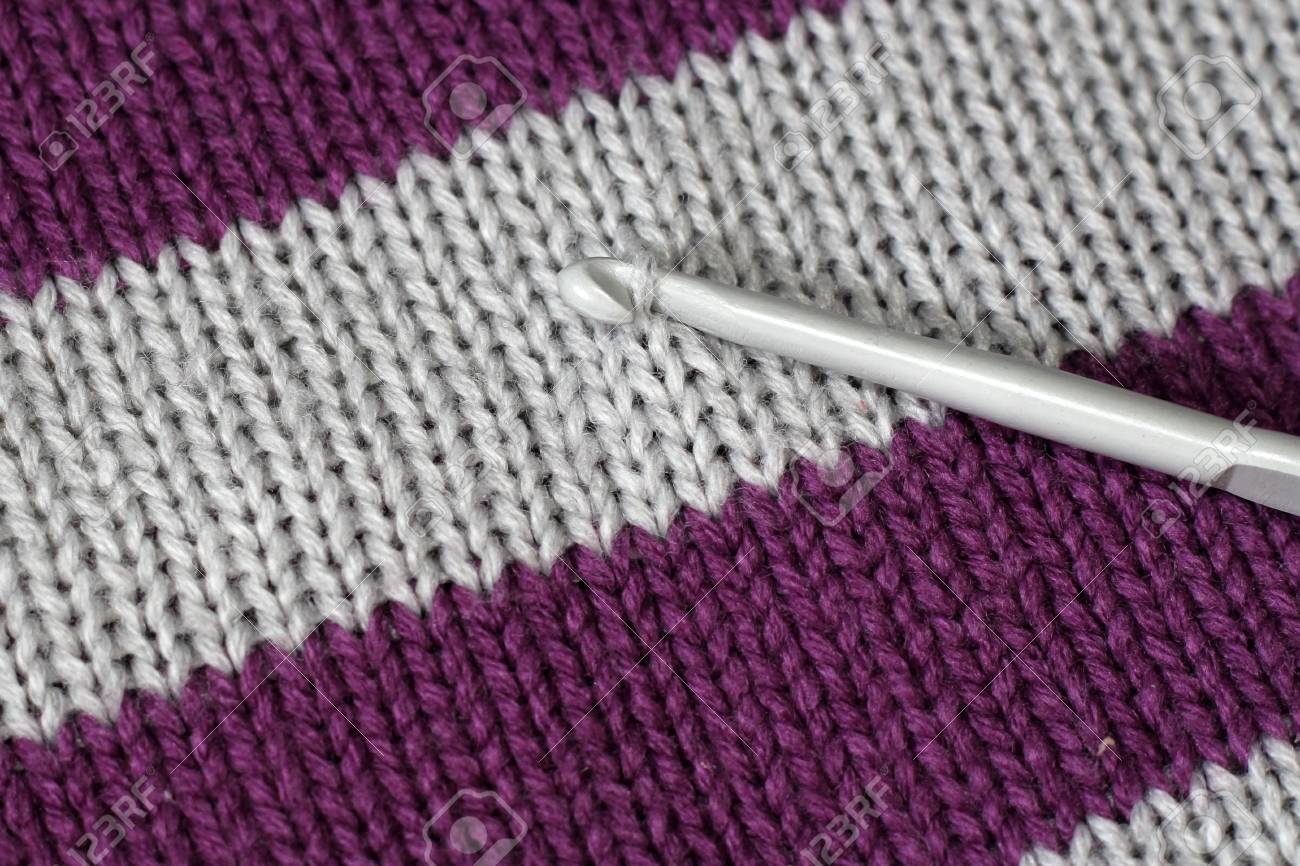 Folded In A Row Knitted Things From Natural Yarn Close Up