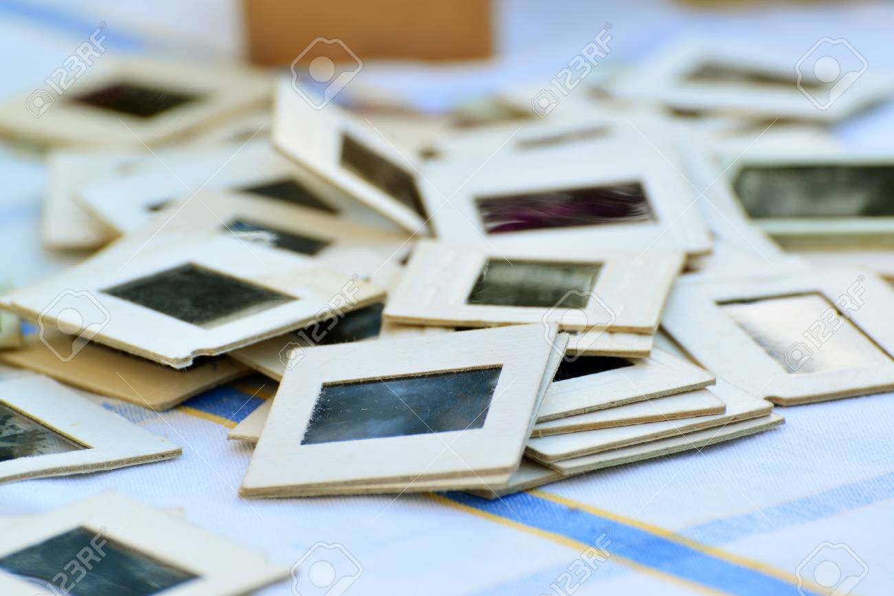 many old slides on the table in the garden stock photo picture and