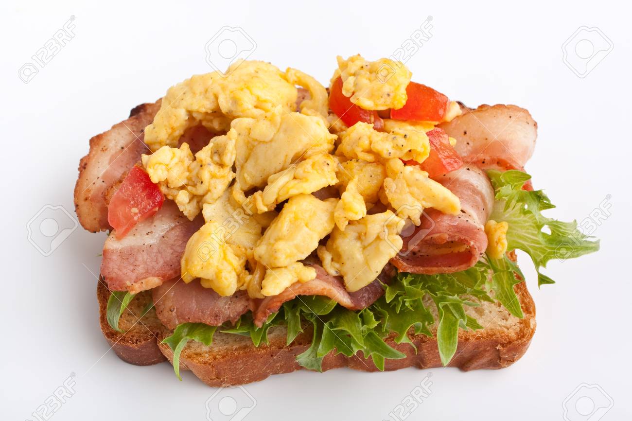 Hot Sandwich With Fried Bacon Scrambled Eggs And Lettuce On White Background Stock Photo Picture And Royalty Free Image Image
