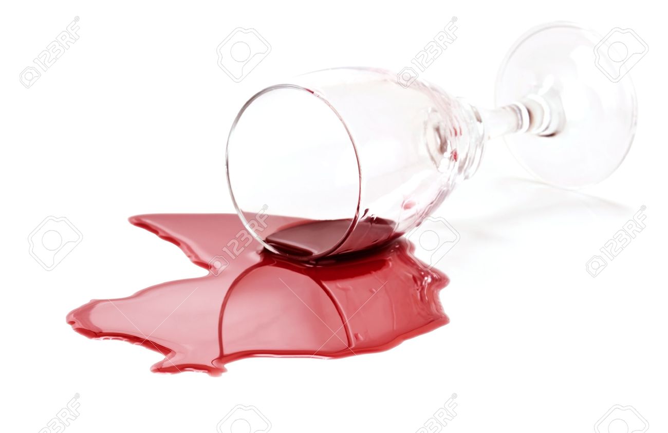 spilled red wine glass isolated on white background stock photo