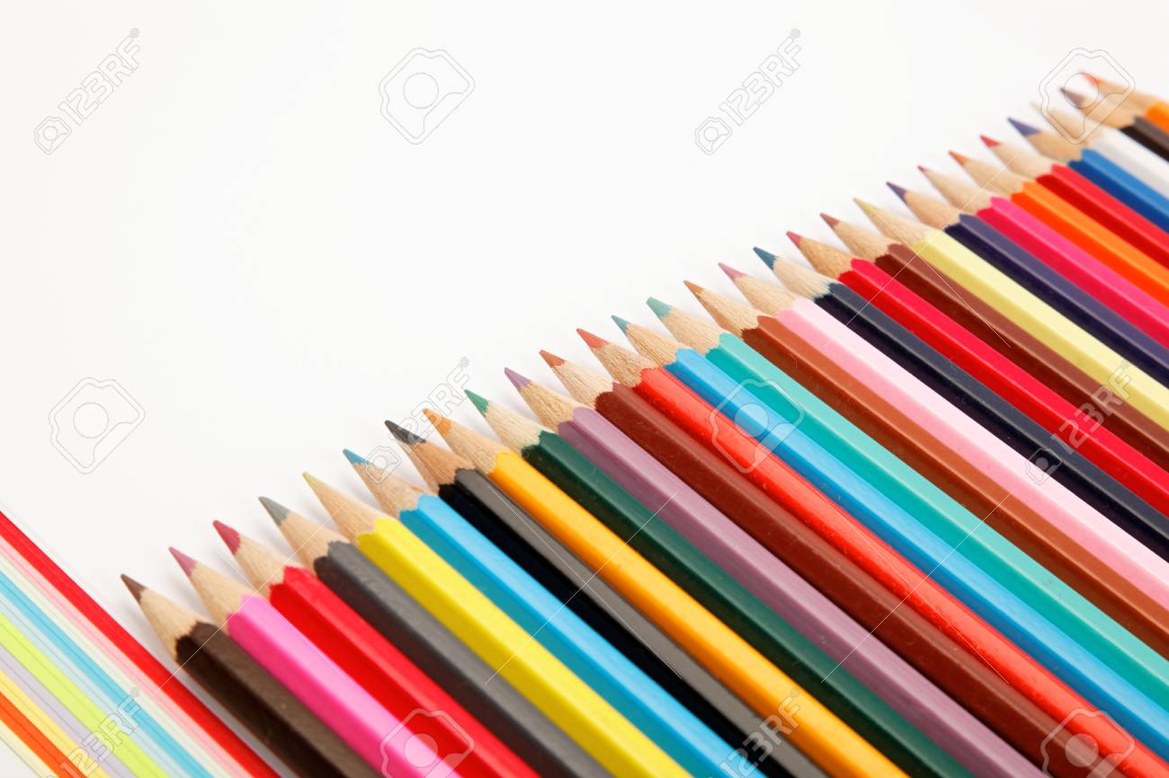 color pencils crayons in arrange in color wheel colors on white