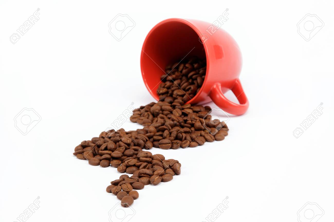 Flow beans from an overturned cup on a white background. - 15021717 Flow beans from an overturned cup on a white background. - 15021717
