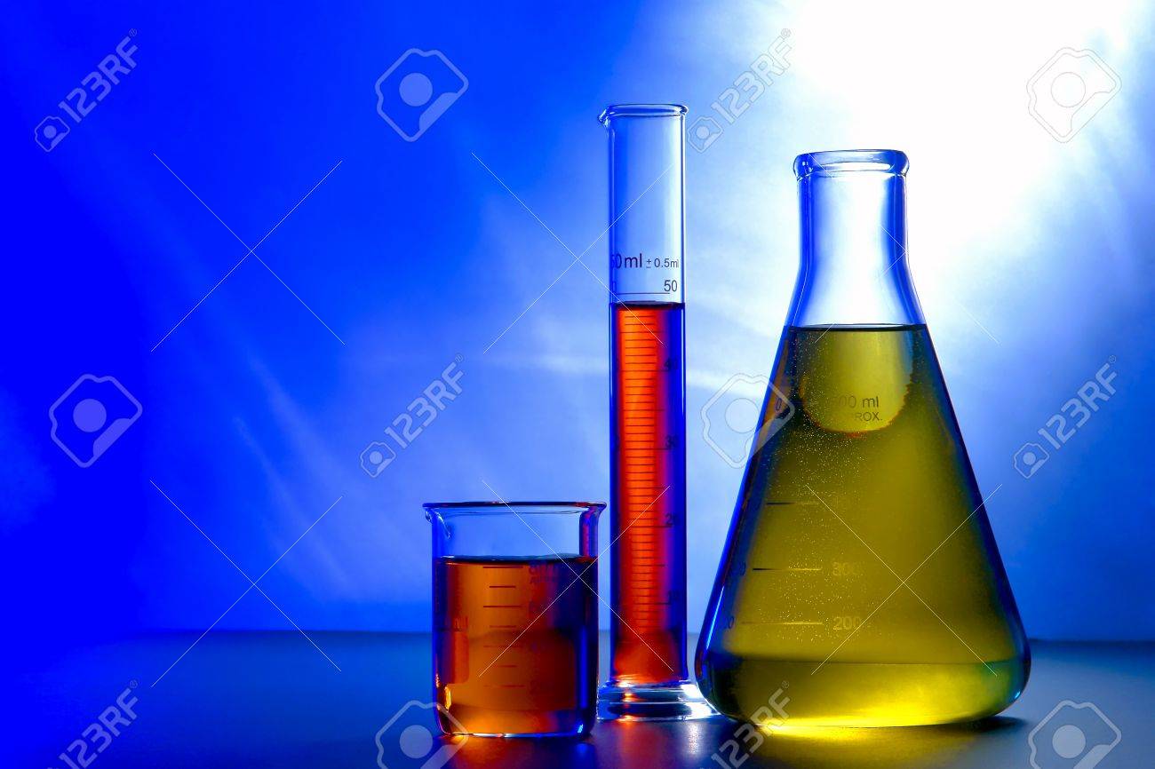 glass erlenmeyer flask with beaker and graduated scientific cylinder