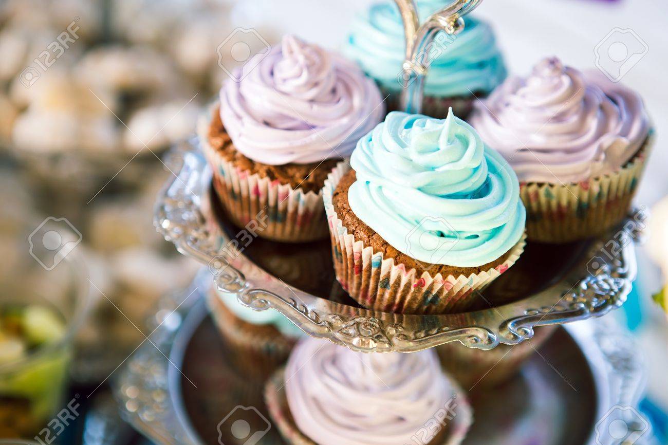 Delicious cupcakes on table on light background - 40858123 Delicious cupcakes on table on light background - 40858123