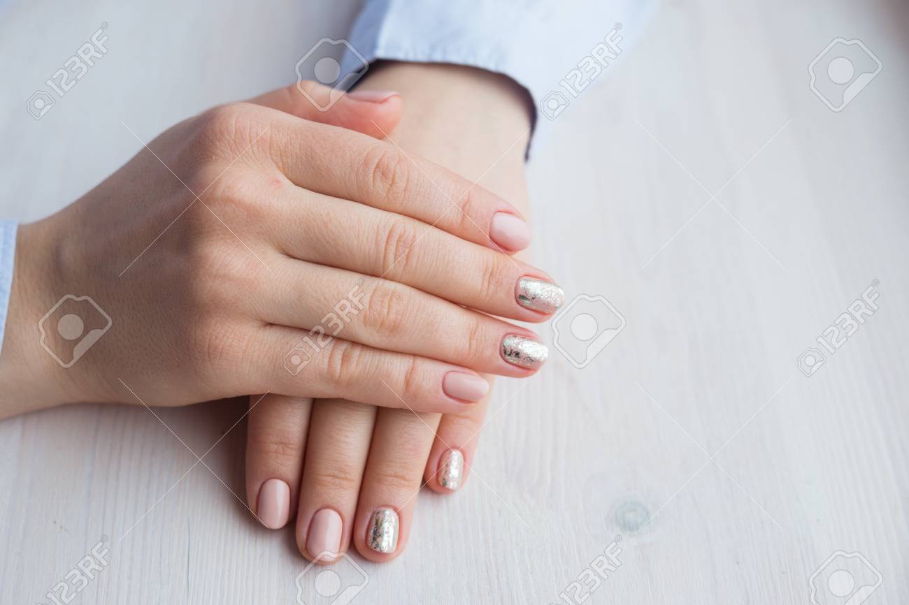Female Hands With Manicure And Pink Polished Nails Stock Photo