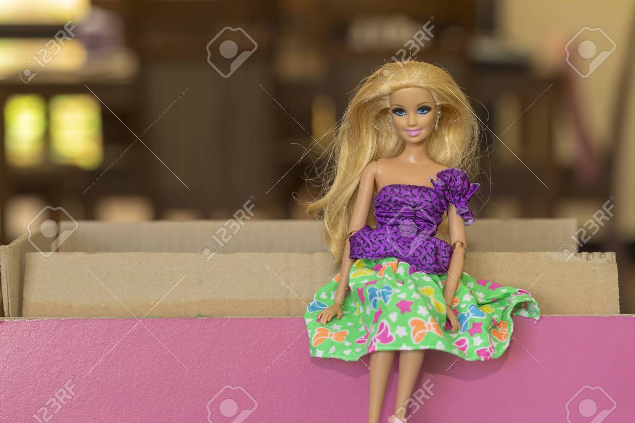 Krabi, Thailand - October 5, 2017: Barbie Doll Sitting On Wood ...